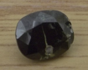 Thorite crystal before mounting in ring.  65 uSv/hour strength.